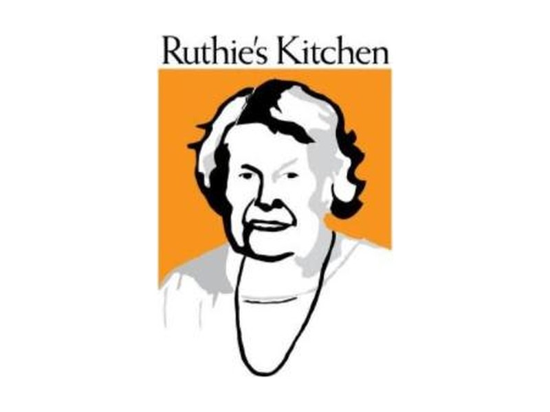 Ruthie's Kitchen logo, a line drawing of Ruthie on an orange background